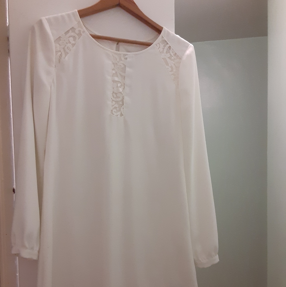 Long sleeve white dress with lace details